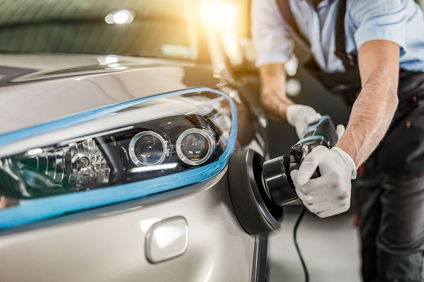 Machine buffing a car Machine buffing a car