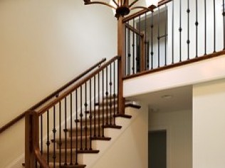 Darwins Staircase Project Picture of a wood and iron staircase in a house.